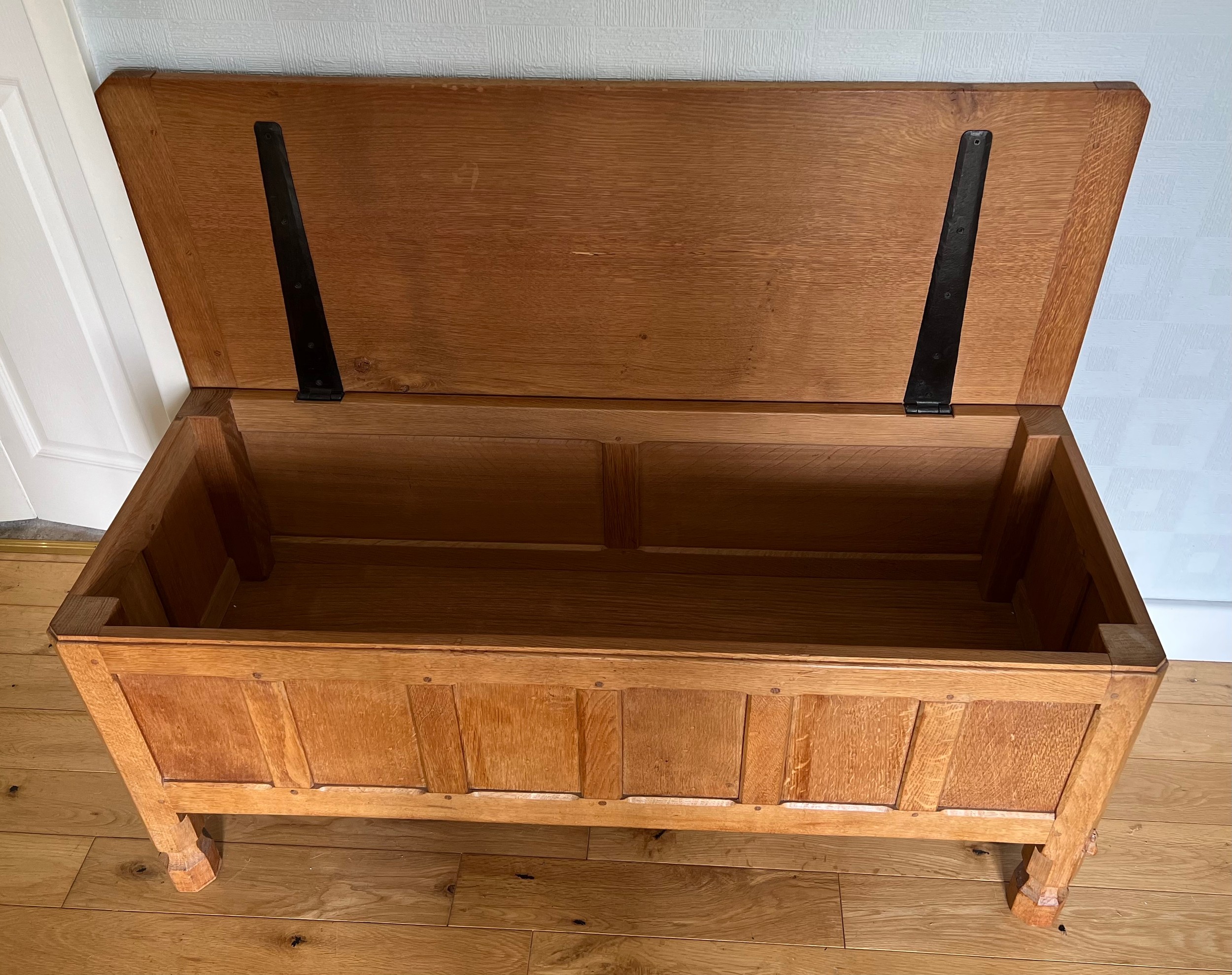 A Robert Mouseman Thompson panelled oak blanket box with hinged top on short octagonal baluster - Image 5 of 8