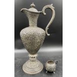 Heavily decorated white metal ewer and small mug, possibly Indian 19thC Indian Kutch silver ? 35cm h