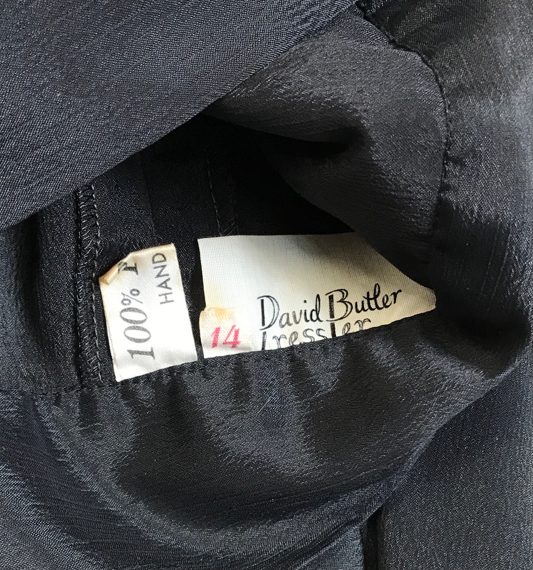 A David Butler 70's Ressler black polyester button box blouse labelled 14 shoulder to hem 44cm - Image 2 of 4