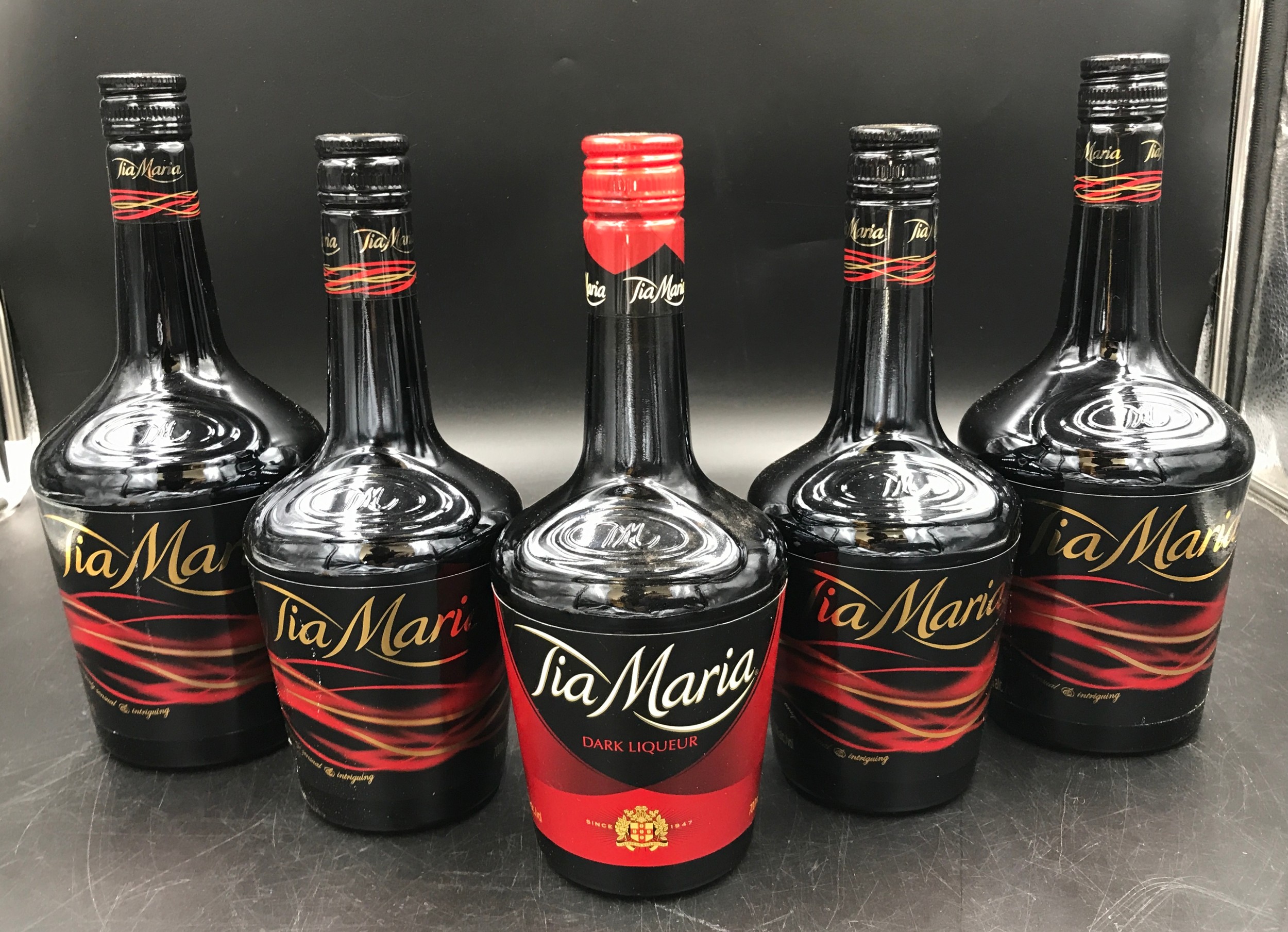 Two 1 litre bottle of Tia Maria and three 700ml bottles of Tia Maria