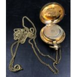 A 19thC sovereign case with chain, marked 18ct rolled gold.