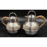 Two silver plated coffee pots. One holding 1 pint the other holding 1 1/2 pint. Tallest standing