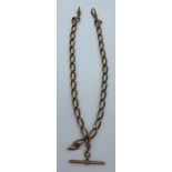 A nine carat gold watch chain with T bar. Total weight 47gm. Length approximately 43cm. T bar