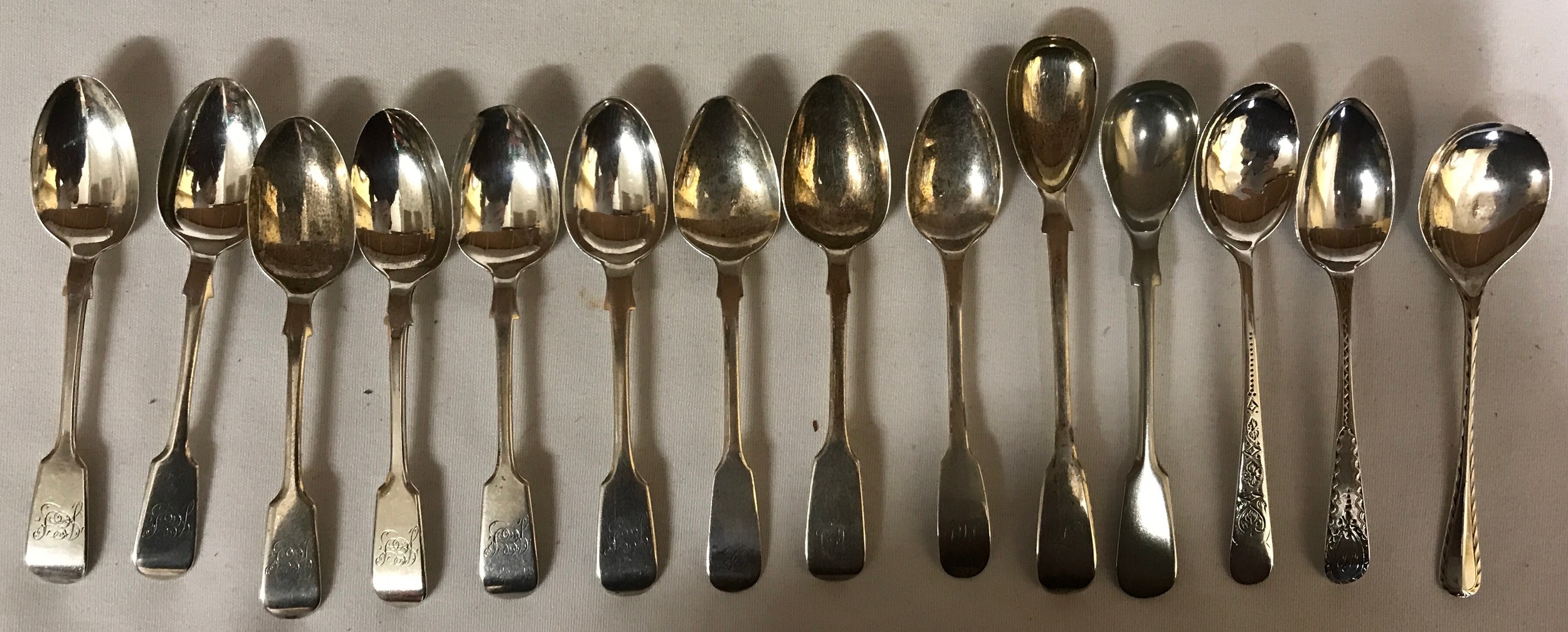 Fourteen hallmarked silver spoons to include 5 matching fiddle pattern teaspoons Exeter 1881, 3