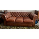 Brown leather upholstered button backed chesterfield sofa. 187 x 87 x 65cm.
