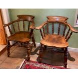 Two oak captains chairs stamped W.L 150. 82cm h to back.