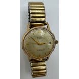 A vintage 9 carat gold Majex Autoslim wristwatch on expanding gold plated bracelet.