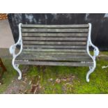 A decorative metal and wooden garden bench. 126cm w.