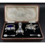 Silver cruet set to include salt, pepper and mustard pots London 1938 together with two spoons One