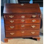 A 19thC mahogany writing bureau with 4 graduating drawers on ogee bracket feet with fitted