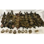 A large collection of vintage and modern horse brasses.