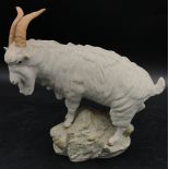 Isle of Man Shebeg pottery model of a goat standing on a rock, signed Harper IoM on back of base.