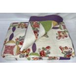 A handmade patchwork quilt. Approx 470 l x 430 w.