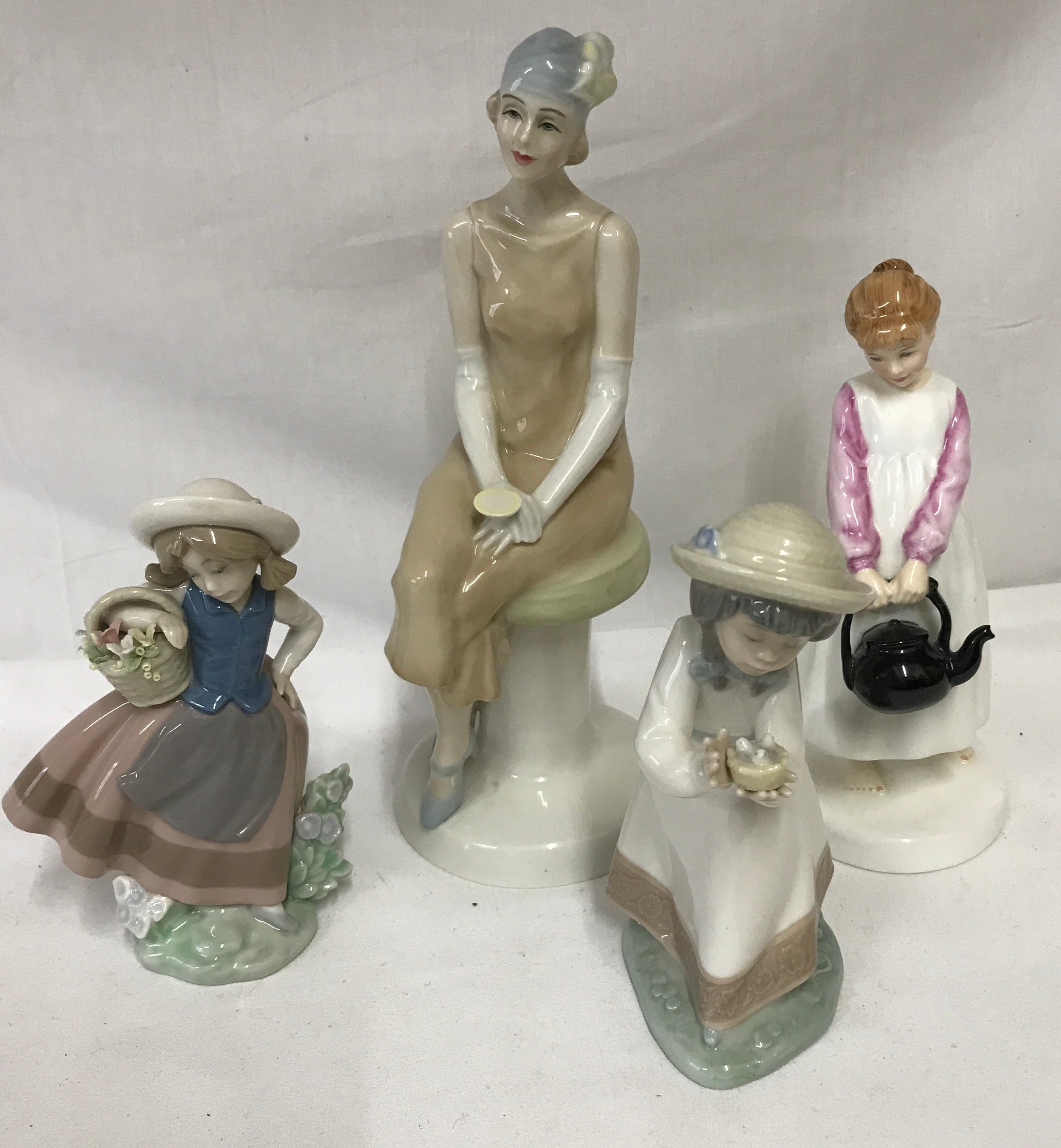 Four figurines two Royal Doulton: Reflections "Cocktails" HN 3070 28cm h and Nursery Rhymes