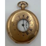 Nine carat gold half hunter pocket watch. 5cm diameter. Total weight 99gm.