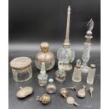 A collection of silver and glass items to include four perfume bottles, perfume pendant, perfume