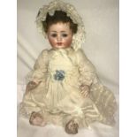 A Max Handwerck porcelain headed doll, "Bebe Elite" marked '90/185 7 Germany" with composition