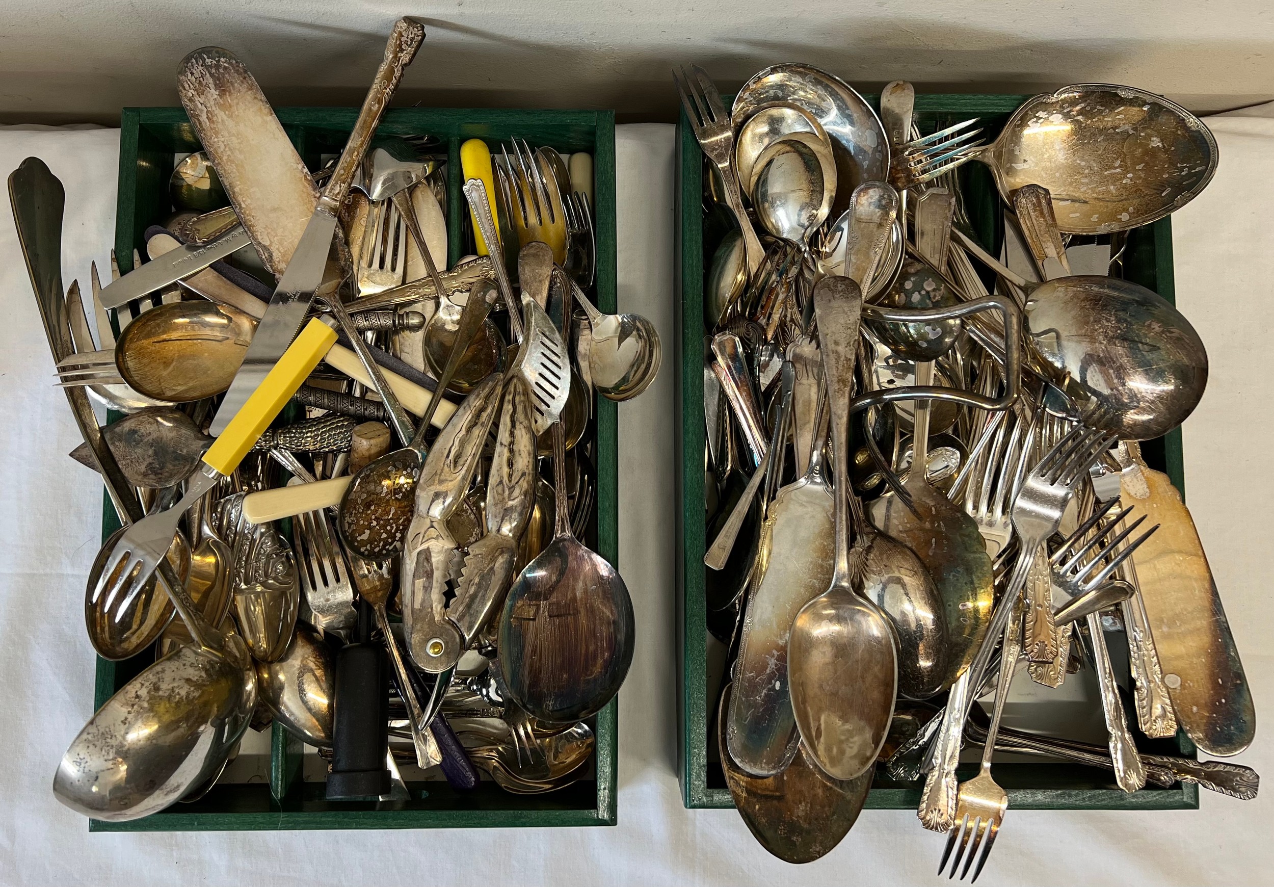 A large quantity of silver plated cutlery to include lobster picks, ladle etc.