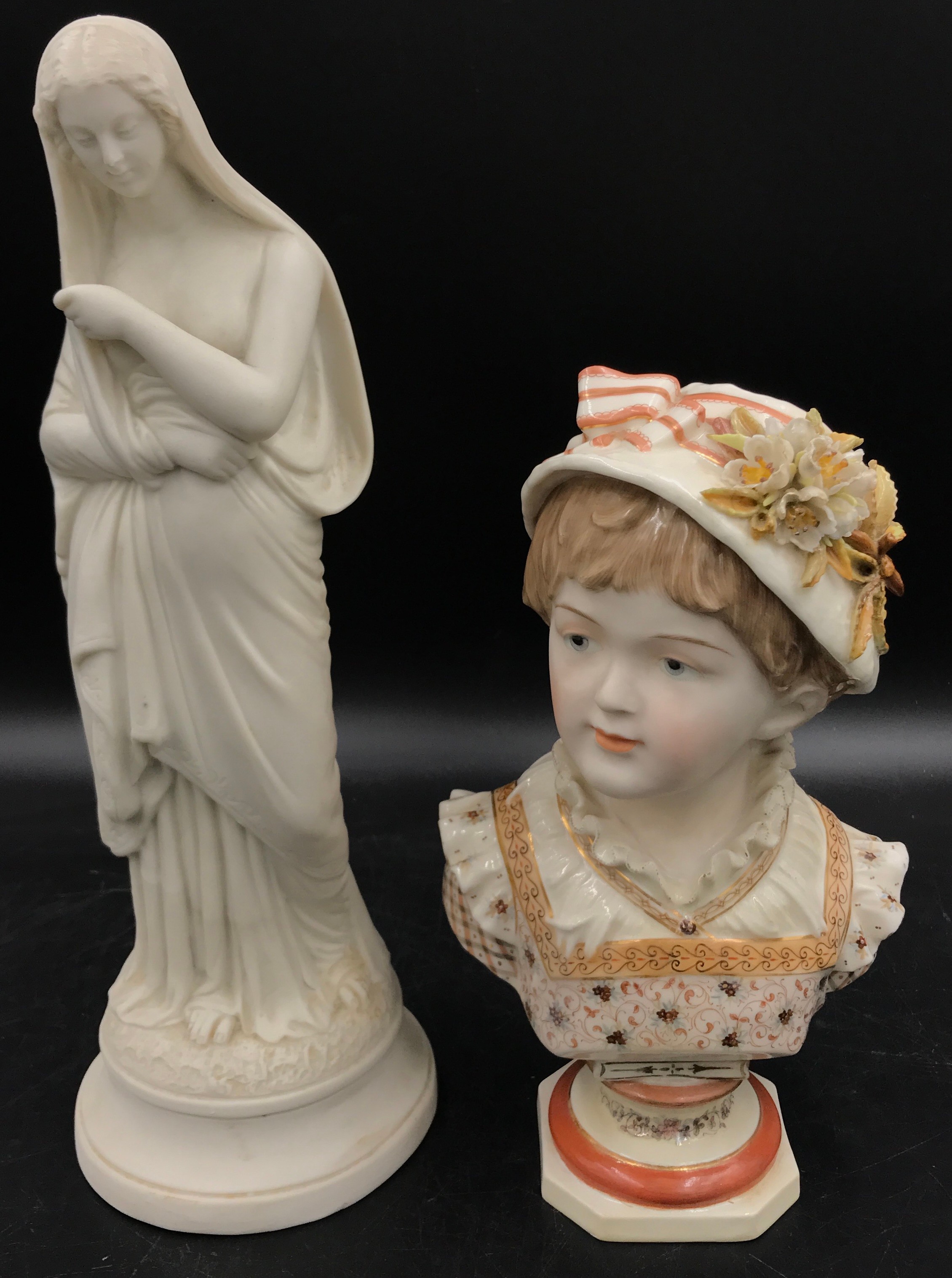 KPM 19thC porcelain bust of a young girl on an octagonal base 25cm together with a tall bisque