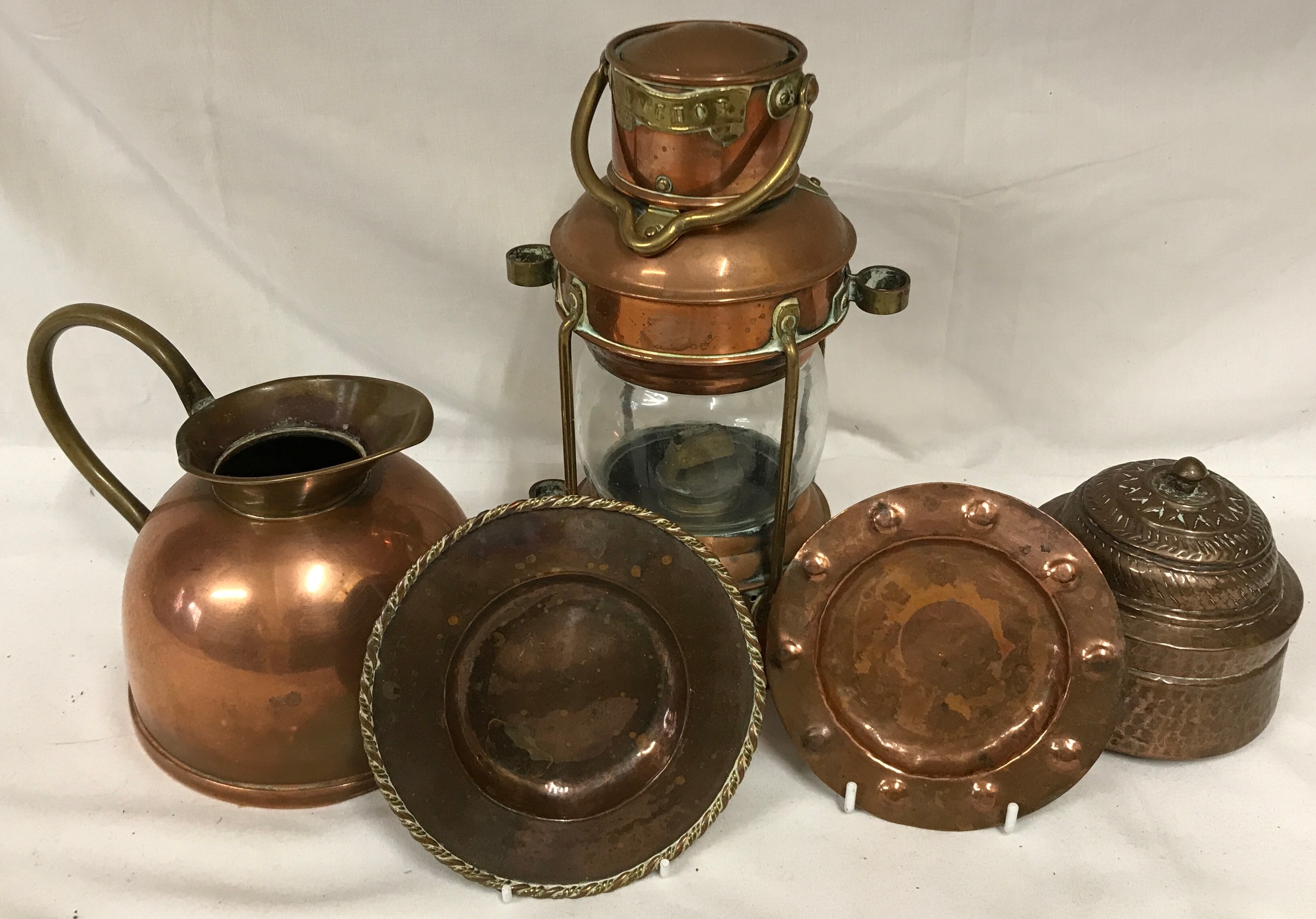 Selection of brass and copper to include a lamp height to top of handle 33cm, copper jug with Linton