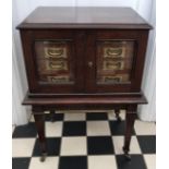 Oak army & navy C.S.L. campaign flatware chest of four inlaid drawers on removable legs with wheels.