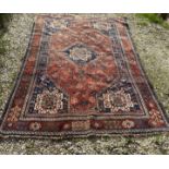 Oriental wool rug measuring approx 272 x 164cm.