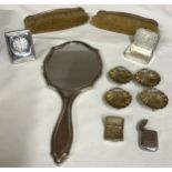 A silver backed hand mirror by Synyer & Beddoes dated 1921, 2 clothes brushes marked A.