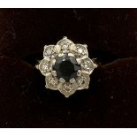 Eighteen carat gold diamond and sapphire cluster ring. Size L. Weight 4.2gm.