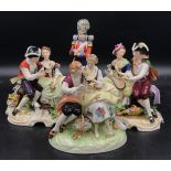 A collection of four ceramic models to include three couples with markings on the base and one royal
