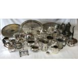 A large collection of silverplate and pewter items to include three trays, kettles, coffee pots,