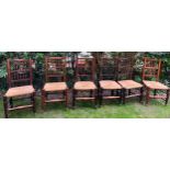 Set of 6 elm spindleback chairs with rush seats.