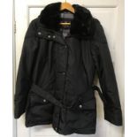 A ladies Barbour jacket size 14 with hood, belt and fluffy collar.