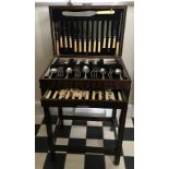 A 20thC mahogany cutlery stand 76 h x 50 w x 35cm d. containing a six piece EPNS cutlery set and