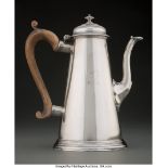 An English Silver Teapot, London, 1735 Marks: (lion passant), (crowned leopard), V, (effaced) 9 x 8