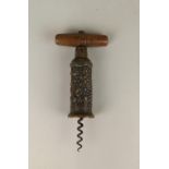 A Thomason type bronze barrel corkscrew cast with grapes, wheat and foliage, with wooden handle