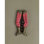 A German novelty ladies legs pocket corkscrew with red and white stockings marked 'Compliments B&L