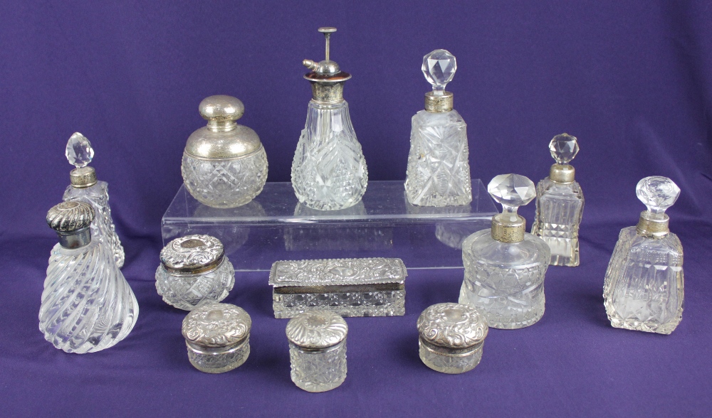 A sterling silver mounted glass perfume diffuser seven various silver mounted glass scent bottles