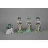 Three 19th century porcelain figures of cherubs holding baskets of flowers tallest 12cm high,