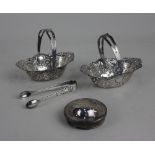 A pair of George V silver bonbon baskets pierced oval form (a/f) one handle detached, Chester 1919 a