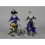 A pair of Chelsea style porcelain figures of a lady seated beside a goat 17cm high, and a