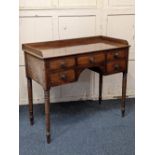 A Victorian mahogany kneehole desk / washstand with three-quarter gallery and rectangular top with