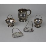 A pair of George V silver salts of basket form Birmingham 1922, a christening mug with engraved