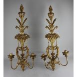 A pair of Victorian style gilt wood two branch wall lights each pierced backplates decorated with