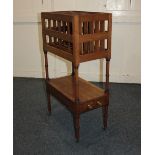 A 19th century mahogany Canterbury whatnot, with six division magazine rack over a lower tier with
