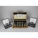 An oak cased set of six pairs of silver plated fish knives and forks, a/f (one foot missing from