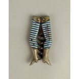 A German novelty ladies legs pocket corkscrew with blue and white stockings marked 'Complements
