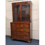 A George III mahogany secretaire bookcase with two arch panelled glazed doors with fitted secretaire