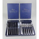 A set of eight pairs of Elkington silver plated fish knives and forks in two original card boxes