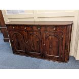 A 19th century mahogany sideboard with quarter column corners, four frieze drawers and three arch