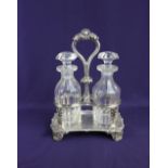 A George IV silver oil and vinegar cruet set by Paul Storr, rectangular form stand with shell and